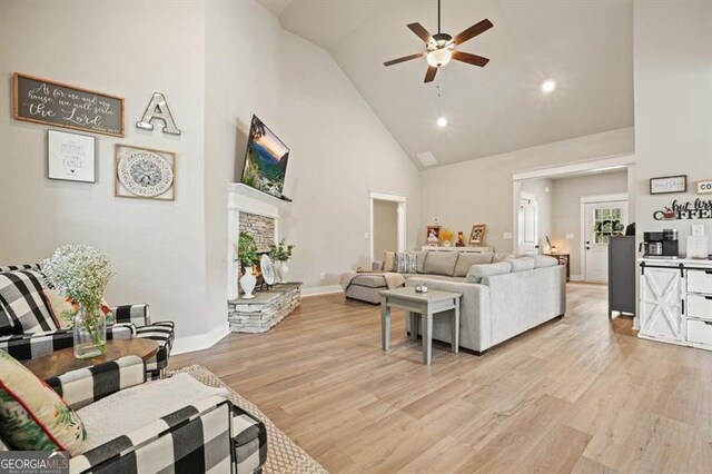 1312 Mcgarity Rd, Temple, GA 30179 - living room featuring high vaulted ceiling, a ceiling fan, light wood-style floors, baseboards, and recessed lighting