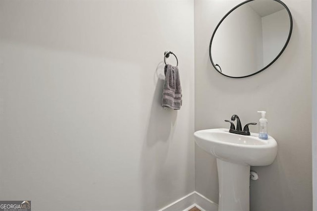 1312 Mcgarity Rd, Temple, GA 30179 - bathroom with baseboards and a sink