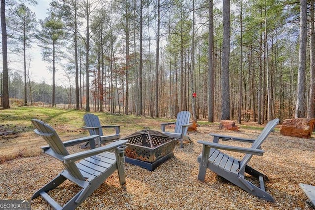 1312 Mcgarity Rd, Temple, GA 30179 - view of yard featuring a fire pit and a forest view