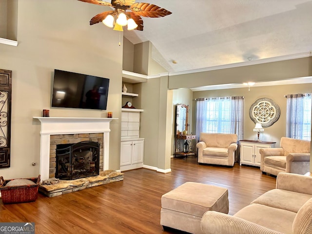 living room with ceiling fan, high vaulted ceiling, a fireplace, wood finished floors, and built in features