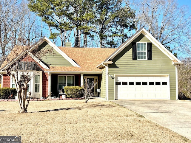 traditional-style house with roof with shingles, driveway, and a chimney