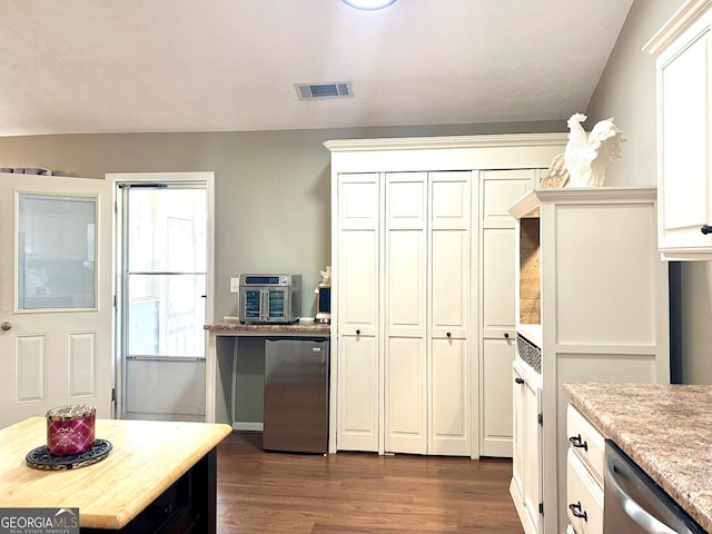 kitchen featuring visible vents, white cabinetry, fridge, dishwasher, and dark wood finished floors