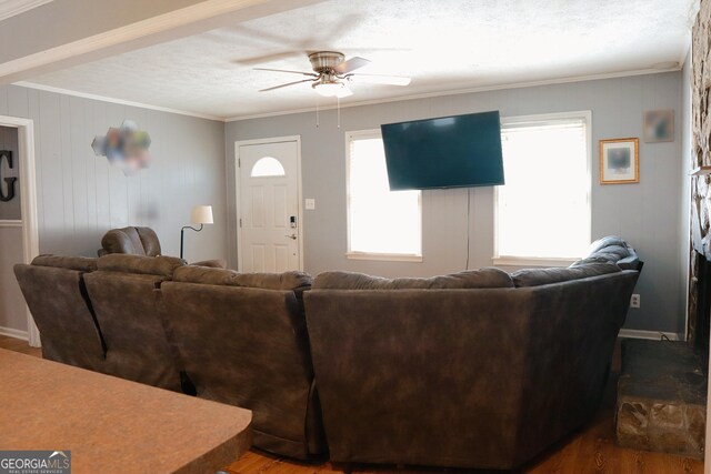 bedroom featuring a textured ceiling and wood finished floors