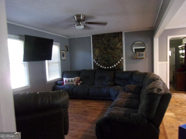 living area featuring ceiling fan and wood finished floors