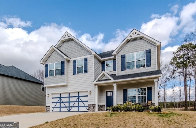 craftsman house featuring a garage, driveway, a shingled roof, and stone siding