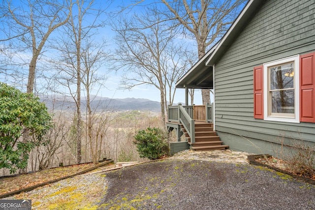 view of property exterior with a mountain view