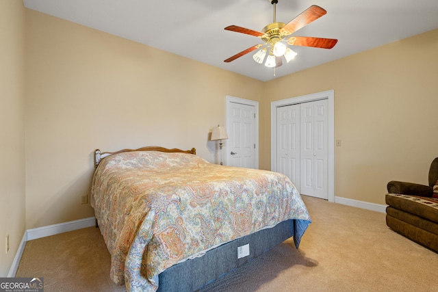 bedroom featuring carpet floors, a closet, a ceiling fan, and baseboards