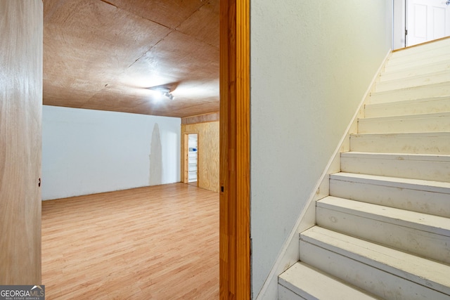 stairway with wood finished floors