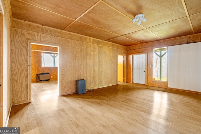 empty room featuring baseboards and wood finished floors