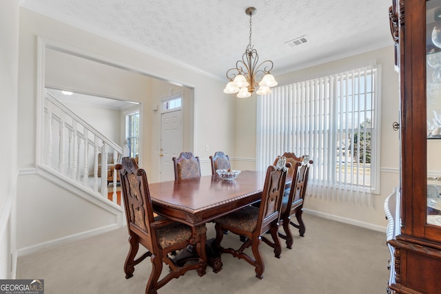 dining space featuring light colored carpet, visible vents, an inviting chandelier, ornamental molding, and stairs