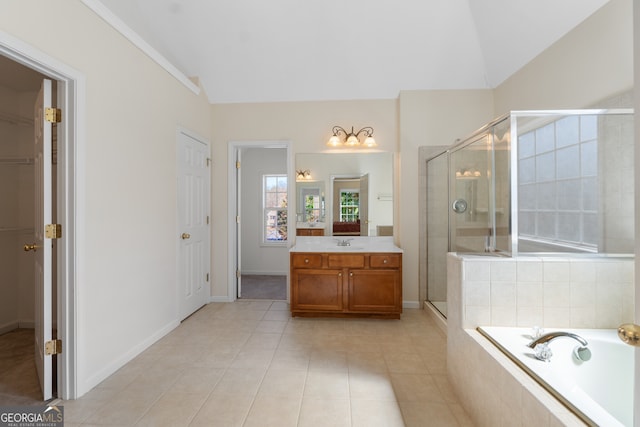 full bath with a shower stall, vaulted ceiling, a closet, and vanity