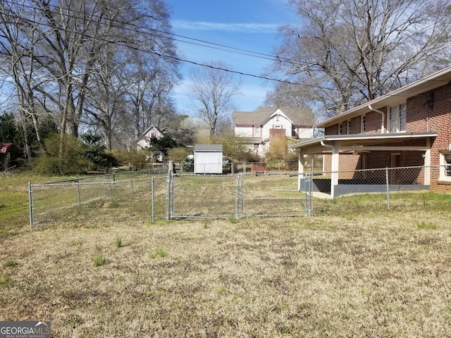 view of yard featuring a gate and fence