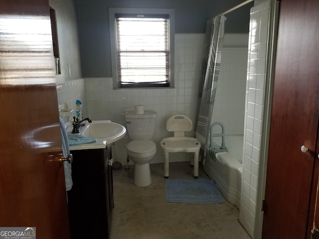 bathroom with shower / tub combo with curtain, tile walls, toilet, wainscoting, and vanity