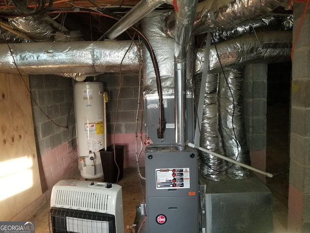 utility room featuring gas water heater and heating unit