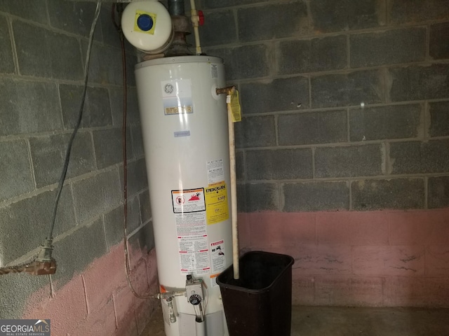 utility room featuring gas water heater