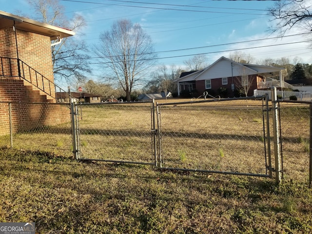 view of yard featuring a gate and fence