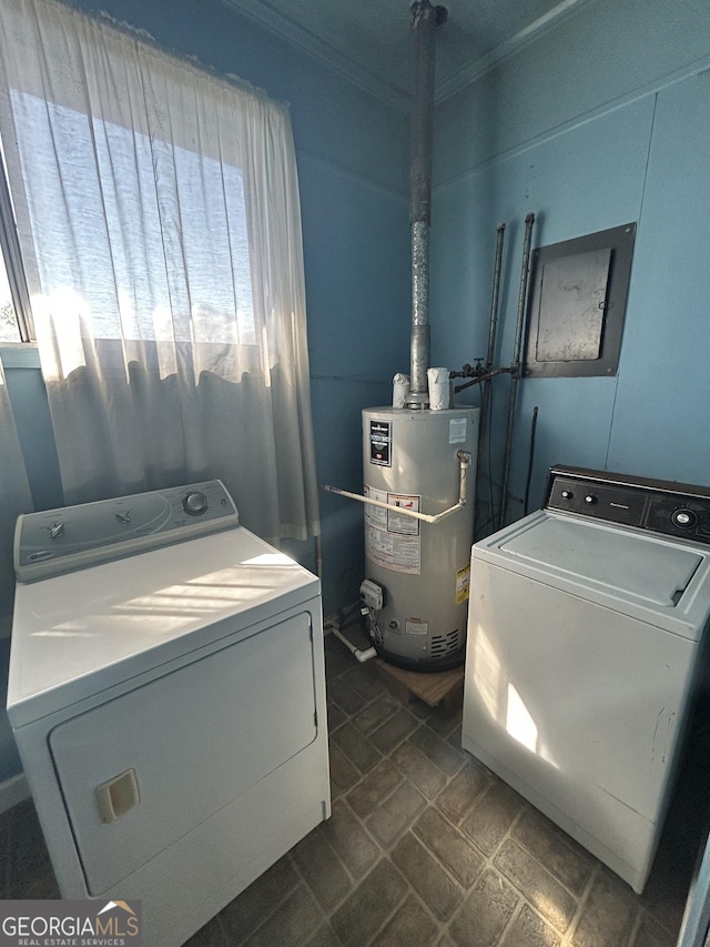 washroom with ornamental molding, laundry area, washer and clothes dryer, and gas water heater