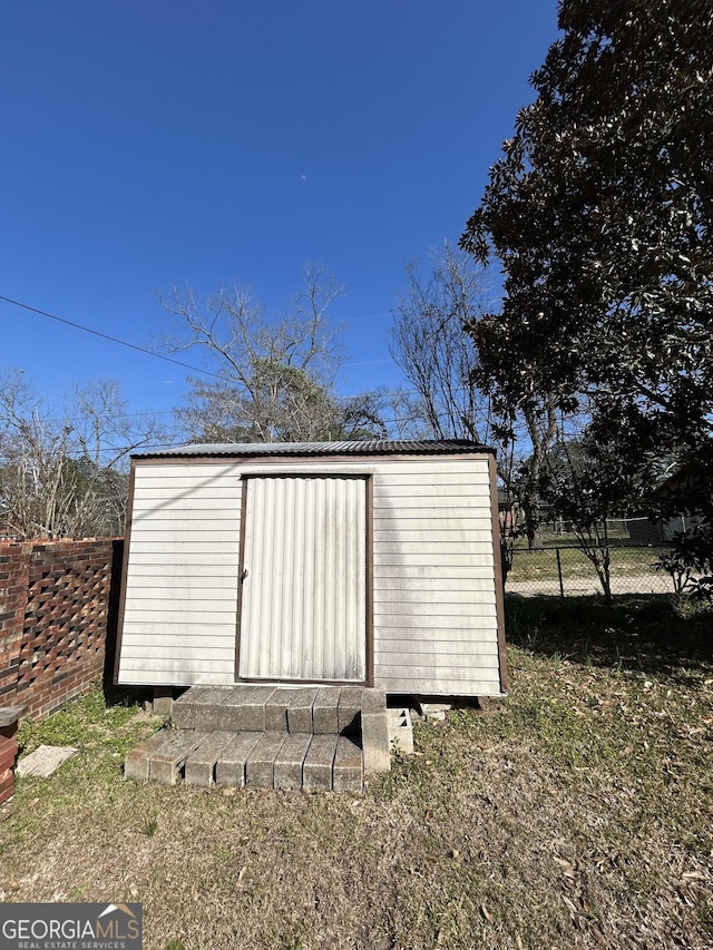view of shed featuring a fenced backyard