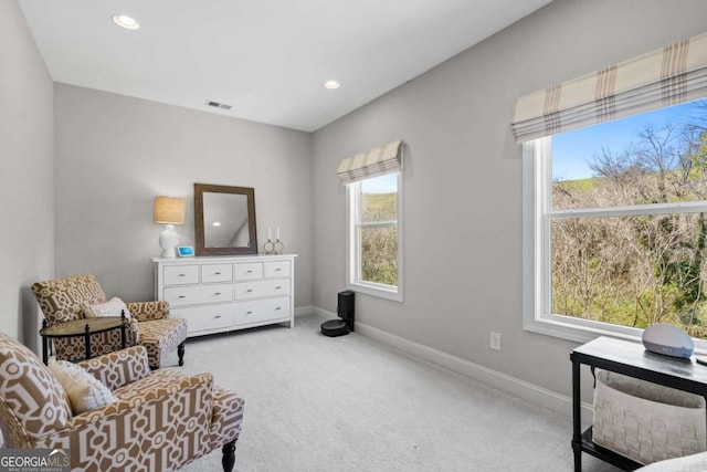 sitting room with carpet floors, recessed lighting, visible vents, and baseboards