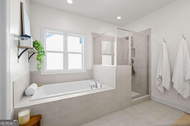 bathroom with recessed lighting, a garden tub, a shower stall, and tile patterned floors