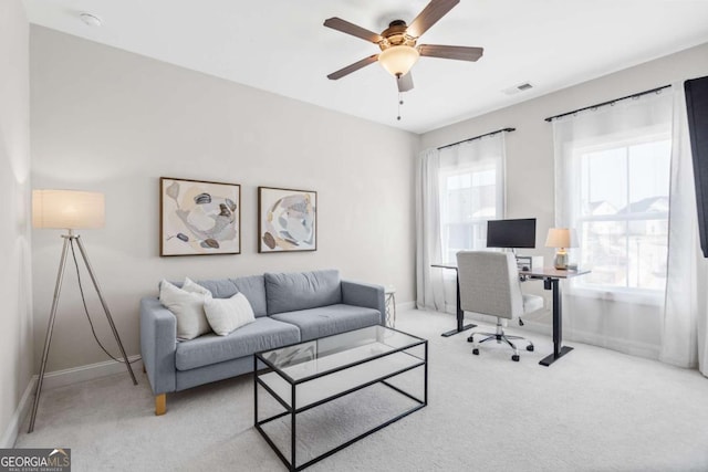 office featuring carpet floors, baseboards, and visible vents