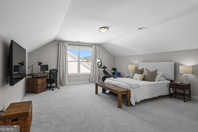 carpeted bedroom featuring vaulted ceiling, visible vents, and baseboards