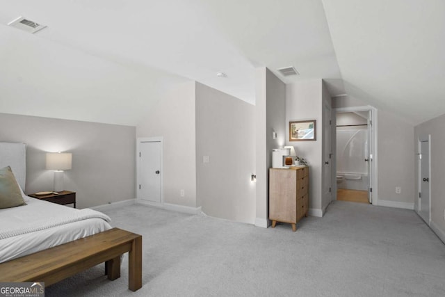 bedroom featuring light colored carpet, visible vents, vaulted ceiling, and baseboards