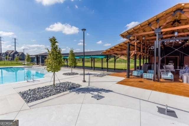 outdoor pool with a patio