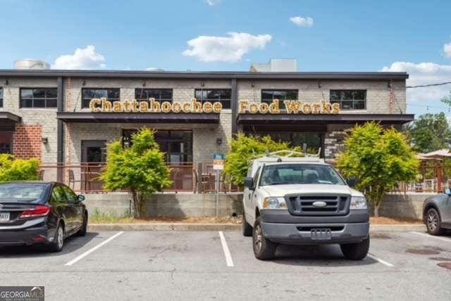 view of property with uncovered parking