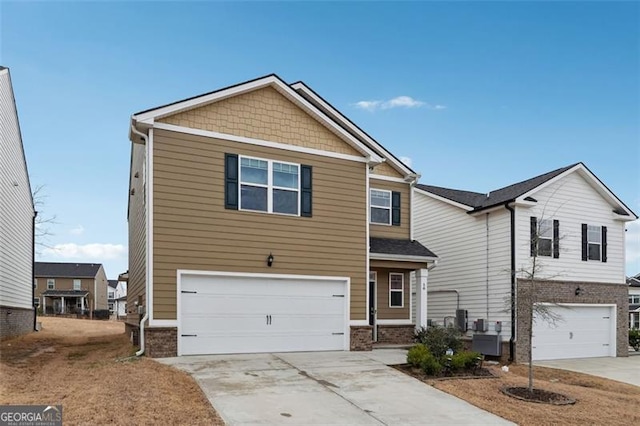 view of front of home with brick siding, driveway, and a garage