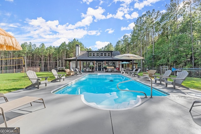 view of swimming pool featuring a fenced in pool, a patio, and fence