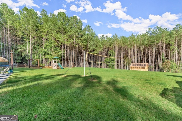 surrounding community featuring volleyball court, playground community, and a yard