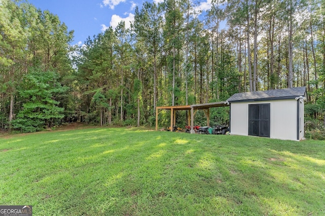 view of yard featuring a carport, an outbuilding, and a storage shed