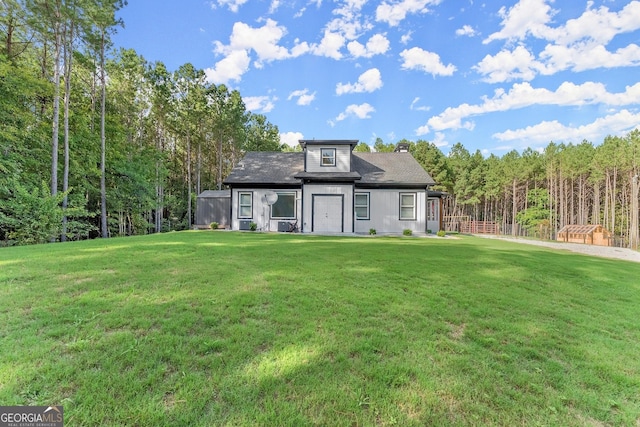 exterior space featuring a yard and a view of trees