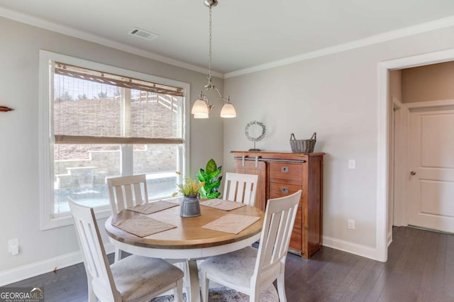 dining area with crown molding, baseboards, and dark wood-type flooring