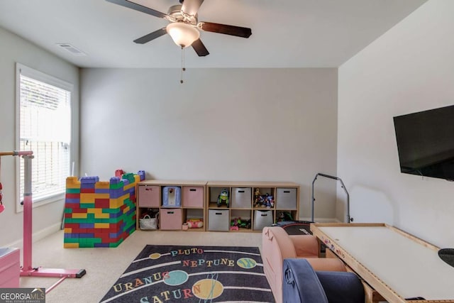 game room featuring carpet floors, ceiling fan, visible vents, and baseboards