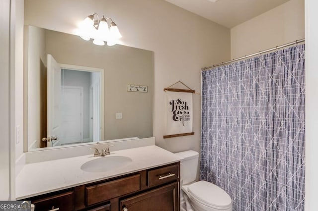 bathroom with toilet and vanity