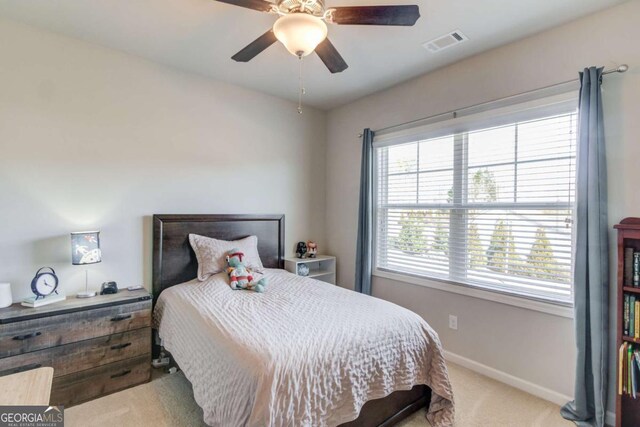 bedroom with ceiling fan, carpet flooring, visible vents, and baseboards