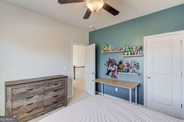 carpeted bedroom with a ceiling fan