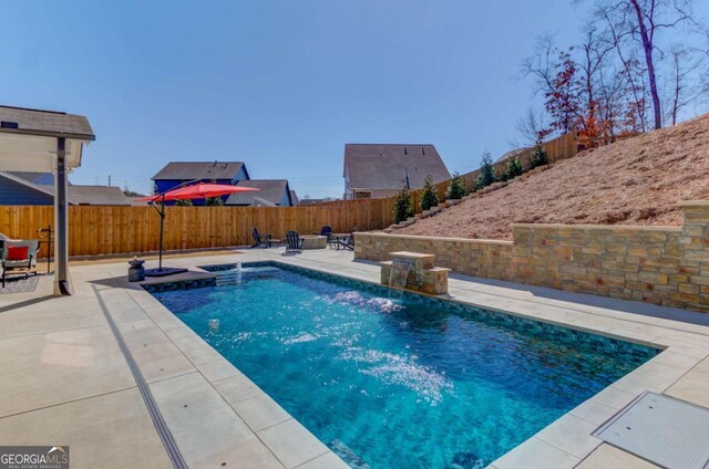 view of swimming pool with a fenced in pool, a patio area, and a fenced backyard