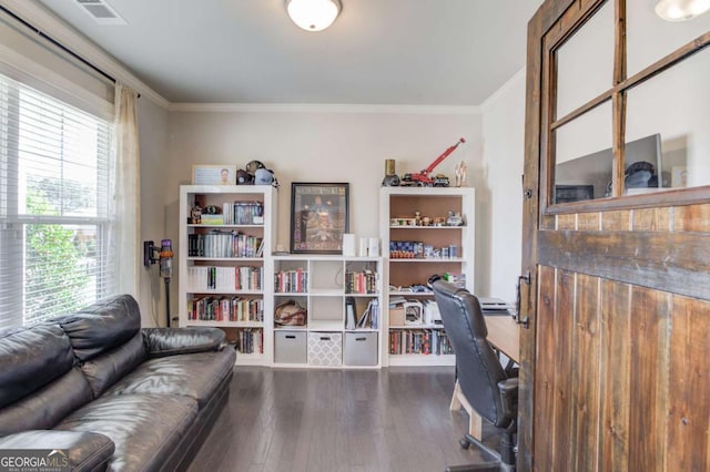 home office with ornamental molding, wood finished floors, and visible vents