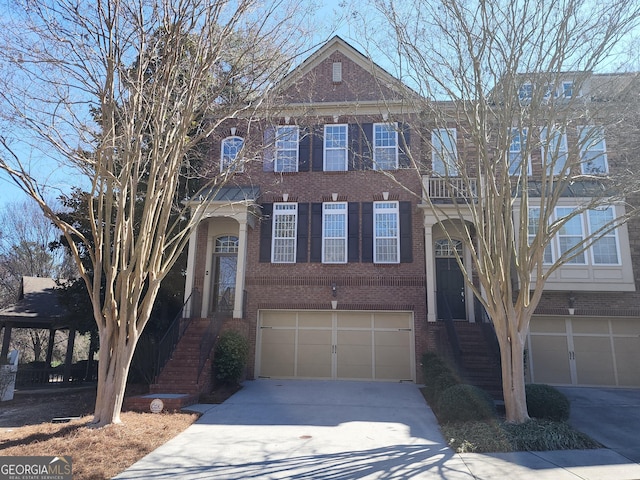 view of front of house featuring driveway, a garage, and brick siding