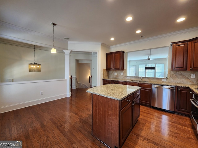 kitchen featuring dark wood finished floors, a kitchen island, light stone countertops, dishwasher, and ornate columns