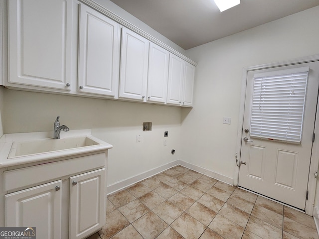 laundry area with washer hookup, cabinet space, a sink, electric dryer hookup, and baseboards