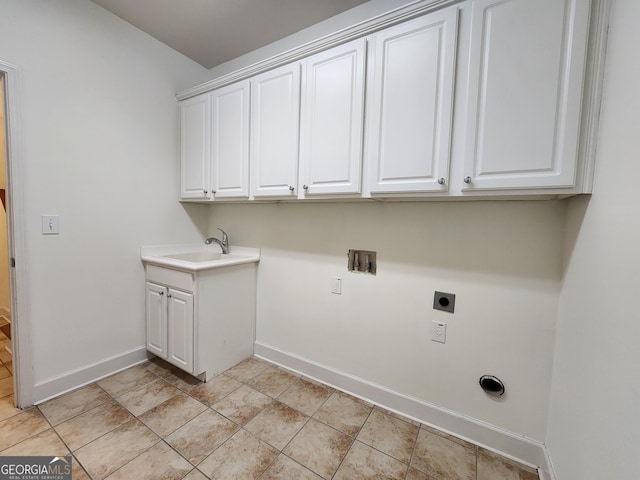 washroom featuring cabinet space, baseboards, hookup for a washing machine, electric dryer hookup, and a sink