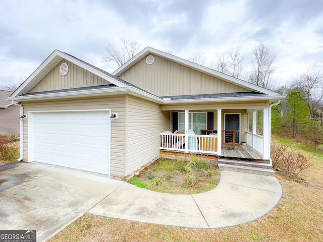 single story home featuring a porch, concrete driveway, and an attached garage