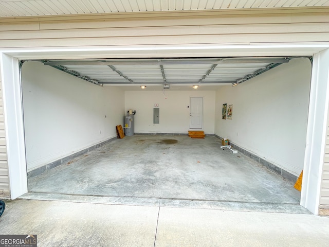 garage featuring electric panel and water heater