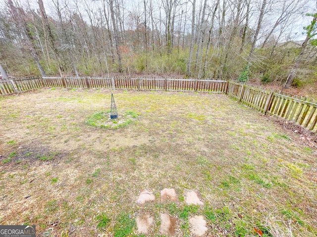 view of yard with a fenced backyard