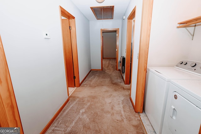 laundry area with light colored carpet, attic access, laundry area, independent washer and dryer, and baseboards