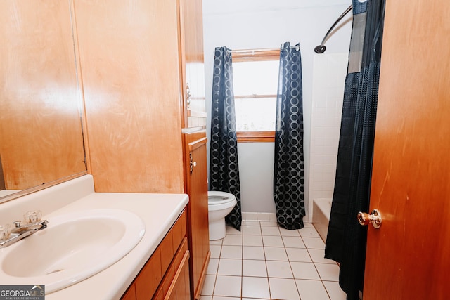 full bath with toilet, shower / tub combo, vanity, baseboards, and tile patterned floors